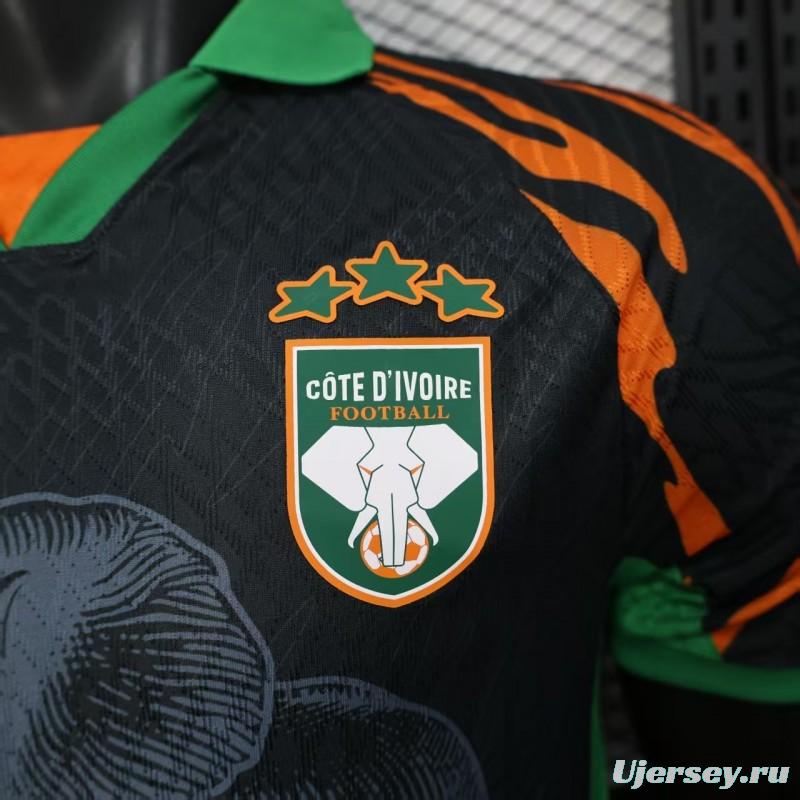 Player Version 2025 Ivory Coast Black with Elephant Graphic and Orange Stripes Jersey
